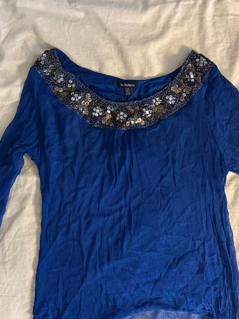 le chateau cobalt blue long sleeve top with beaded neckline